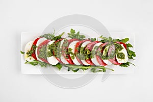 Top view on isolated classic caprese salad photo