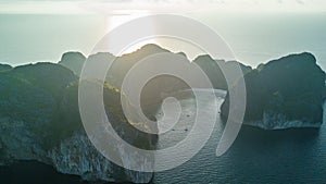 Top view of isolated rocky tropical island with turquoise water and white beach. Aerial view of Phi-Phi Leh island with Maya Bay