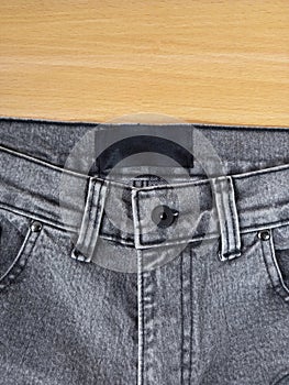 Top view of jeans with plain label tag