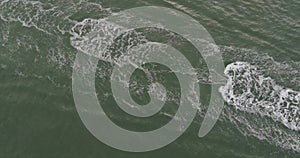 Top view of jet skis cruising in clear waters