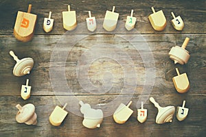 Top view of jewish holiday Hanukkah with wooden dreidels