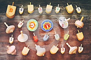 Top view of jewish holiday Hanukkah with wooden dreidels