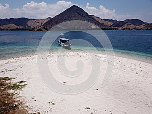 Top view of `Kelor Island` in an afternoon before sunset with turquoise sea and tourist boats, Komodo Island Komodo National Park