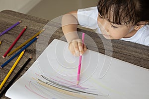 Top view of kid drawing with color