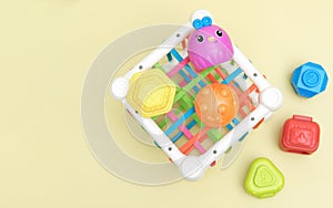 top view of kids educational toy, colorful cube with details for skills developing and brain boost. montessory method. photo