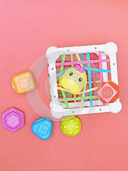 top view of kids educational toy, colorful cube with details for skills developing and brain boost. montessory method photo
