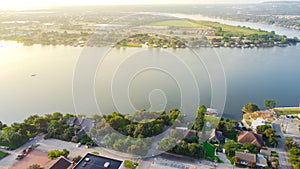 Top view Lake Granbury and Brazos River near historic downtown with waterfront residential and commercial properties