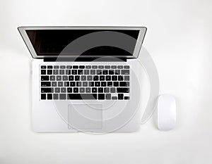 Top view of laptop computer with open display screen monitor and mouse isolated on white background
