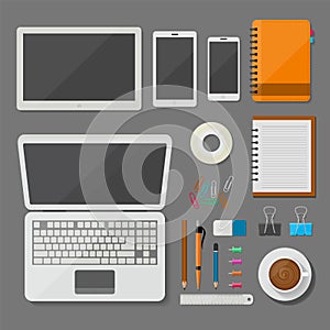 Top view laptop, tablet, smartphone, and workplace with office items and business elements vector design