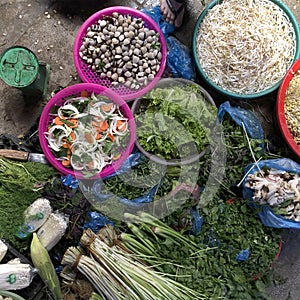Top view on a large assortment of row loose vegetables and fruits for sale in a street. Short circuit production photo