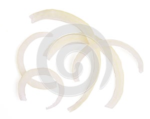 Top view large onion slice into strips on white background