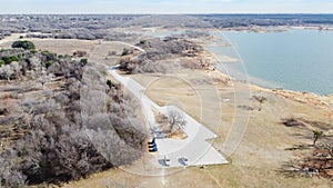 Top view large parking lots near woody park and lakeside picnic area at Grapevine Lake, Texas, America