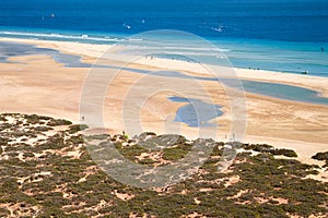 Top view of the large wide sandy bay of Risco del Paso on the Spanish island of Fuerteventura