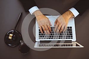 Top view lawyer working on his desk with laptop at law firm. Equilibrium