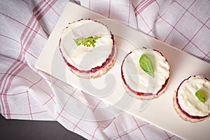 Top view of layered fish salad with beetroot, potato, onion, herring and mayonnaise. Salad herring under fur coat served in