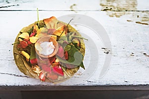 Top view of Leaf bowl with flowers and oil lamp floating on the Ganges river, Varanasi, Uttar Pradesh, India, Asia