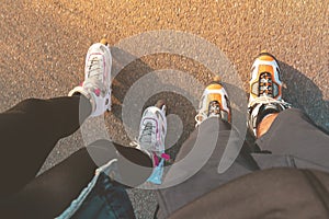 Top view of legs with inline skates. Boy and girl on roller skates. Place for text.