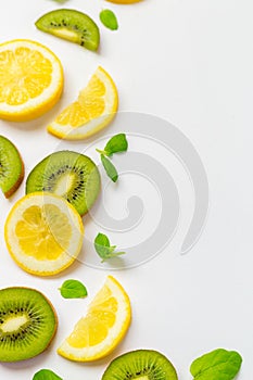 Top View of Lemon Kiwi and Peppermint on White Background, Free Space for Text