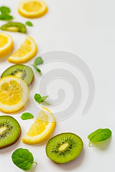 Top View of Lemon Kiwi and Peppermint on White Background, Free Space for Text