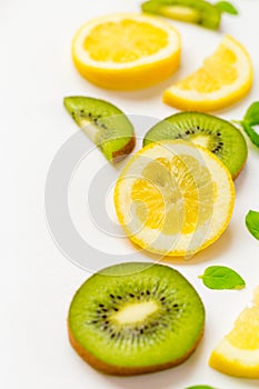 Top View of Lemon Kiwi and Peppermint on White Background, Free Space for Text