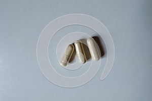 Top view of light beige capsules of Saccharomyces boulardii probiotic