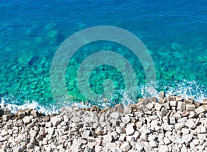 Top of view limpid water on gravel beach