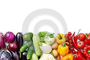 Top view of line made of different vegetables and berries on white background