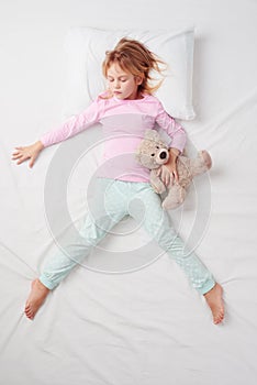 Top view of little girl sleeping in Freefaller