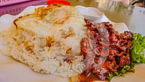 Top view of lok lak Beef with Fried egg on the rice in cambodia