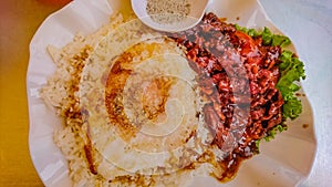 Top view of lok lak Beef with Fried egg on the rice in cambodia