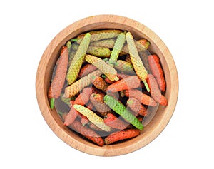 Top view of long pepper or piper longum in wooden bowl