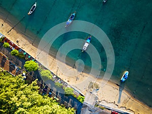 Top view Longtail fishing boats in the tropical sea at Rawai beach Phuket Thailand, Beautiful sea surface High angle view from