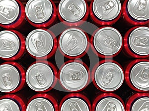 Top view of a lot of red aluminum soda drinks