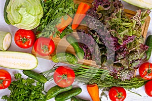 Top view of lots of vegetables on wooden table