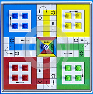 top view of a ludo game board with dice