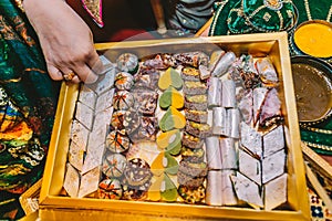 Top view of luxury box of tasty indian sweets, candy