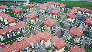 Top view of luxury suburban apartment complex. Clip. Aerial view apartment buildings complex and residential houses