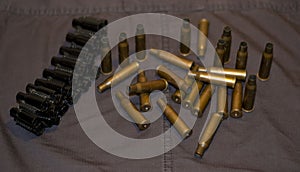 Top view of machine gun ammunition belt on  uniform background