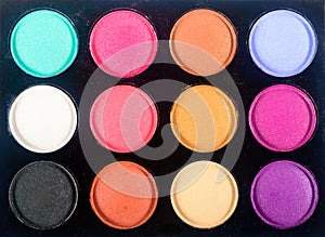 Top view of make-up eyeshadow palette.Close up of a colorful assortment of eye shadow cosmetics.Close-up eye shadow set