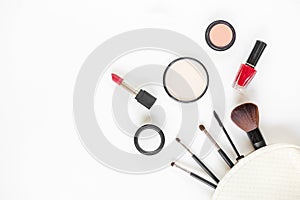 Top View. Makeup cosmetics tools and beauty cosmetics, products and facial cosmetics package lipstick, eyeshadow on the white bac
