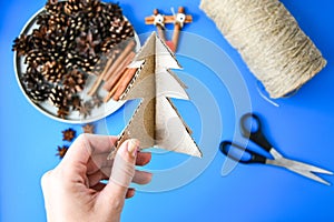 Top view of Making little Christmas tree of cardboard. Children`s art project, a craft for children. DIY concept. Step by step 6