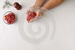 Top view of male hand molding a hamburger 3