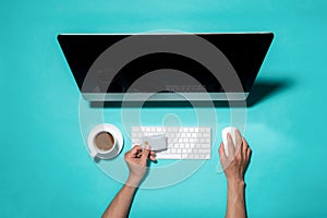 Top view of male hands making online payment