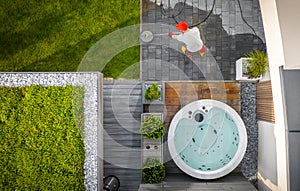 Top View of Man Cleaning His Modern Backyard