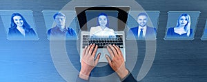 Top view of man fingers on laptop keyboard with human resources, personnel icons