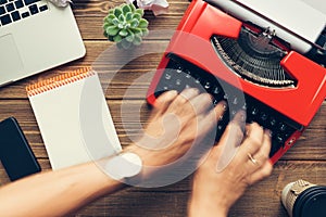 Top view of man using typewriter