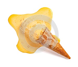 Mango flavor ice cream cone in a melting process on white with clipping path photo
