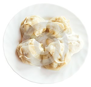 Top view of manti dumpling on white plate isolated