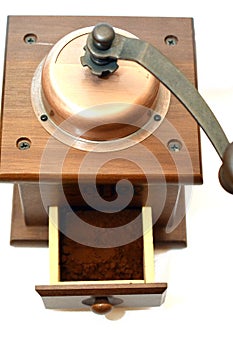 A top view of a manual coffee grinder burr mill machine with catch drawer, conical burr mill and spice hand grinding