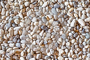 Top view of many pebbles in light brown